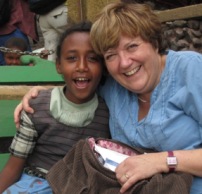 Joy visiting her sponsored child